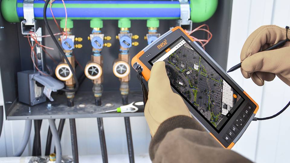 Man monitoring and marking Irrigation Boxes using Juniper Handheld Device